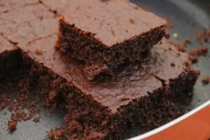 Close-up photo of freshly baked chocolate brownies, rich and moist.