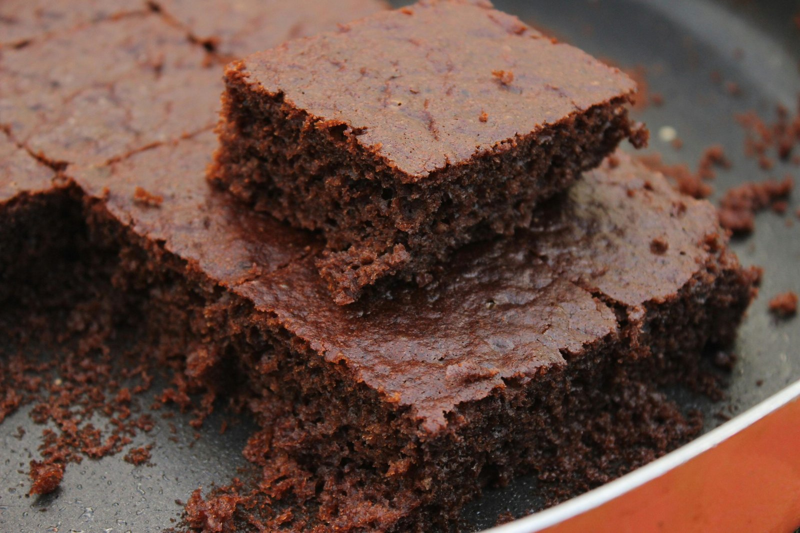 Close-up photo of freshly baked chocolate brownies, rich and moist.